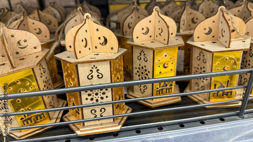 Fényképezés Ornate wooden lanterns glow warmly, capturing Eid's mystique and illuminating Ra