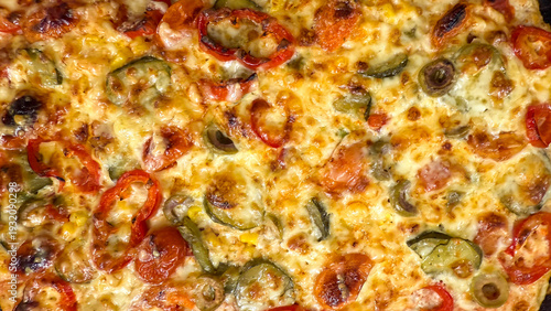 Melty cheese symphony serenades roasted peppers and olives on baked dough, evoking a culinary ode to National Pizza Day