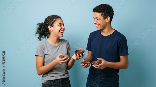 Teenagers enjoying chocolate Easter eggs and sharing joyful moment