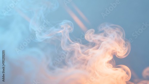 Close-up of swirling orange and blue smoke against a clear blue background with a dreamy atmosphere.
