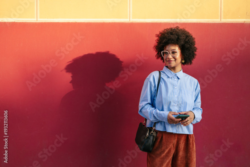 Woman in downtown with a colorful urban backdrop