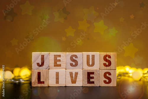 Jesus Lives wooden blocks for Christian Easter Sunday resurrection celebration background