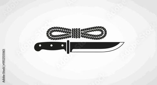 Knife with black handle and rope.
