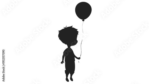 Little boy holding black balloon in airy space