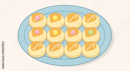 Delicious assortment of cute cartoon-style pastries on a blue serving plate with pastel icing dots and sweet toppings for dessert lovers