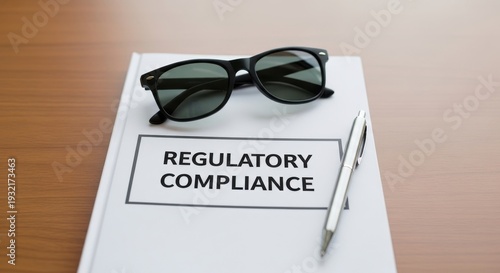 Sunglasses Resting on Regulatory Compliance Document with Pen