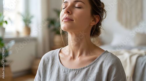 Young Woman Practicing Mindfulness Meditation and Deep Breathing Exercises at Home for Mental Health Wellness and Stress Relief