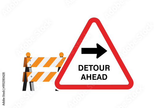 Traffic detour ahead sign and barrier indicating road closure and rerouting