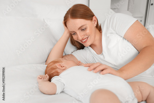 Beautiful young mother with...
