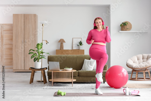 Young happy overweight woma...