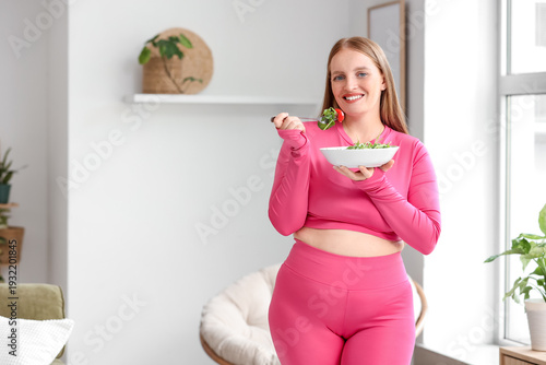 Young happy overweight woma...