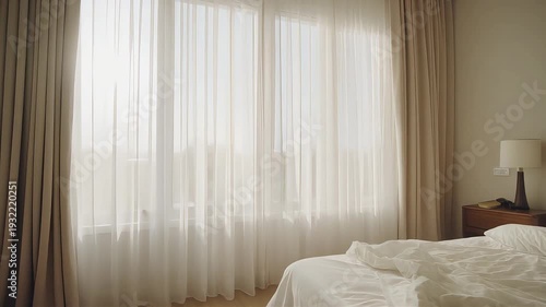 Serene Bedroom Scene with Sheer Curtains and Soft Bedding from a Calm Viewpoint