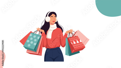 Stylish woman wearing earmuffs and a scarf holds several colorful christmas shopping bags decorated with snowflakes and tree patterns.