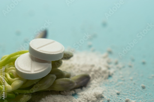 Minimal pharmaceutical concept with tablets and organic texture