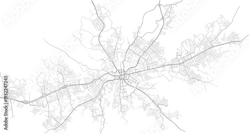 Aerial view of a city's infrastructure and transportation network with roads and pathways