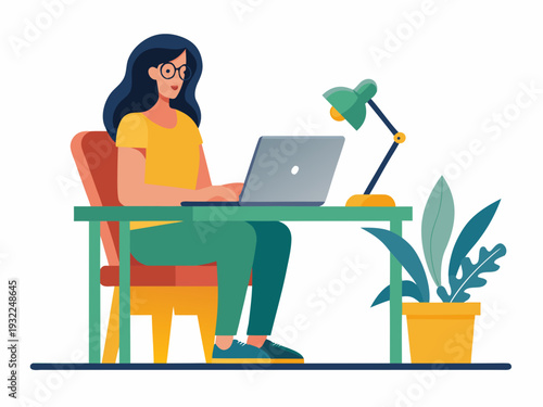 A young woman works on a laptop at a bright modern desk