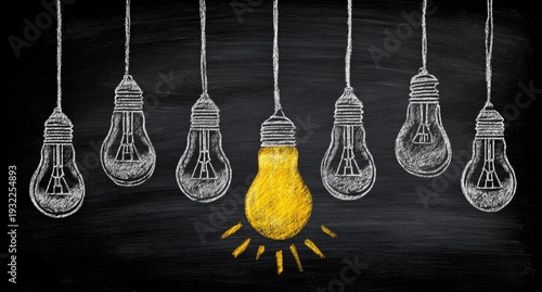 Chalk drawing of light bulbs symbolizing idea, innovation and solution.