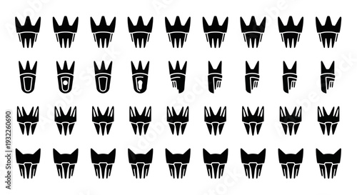 Collection of various crown and animal face icons displayed in a grid pattern on a plain surface from a direct viewpoint