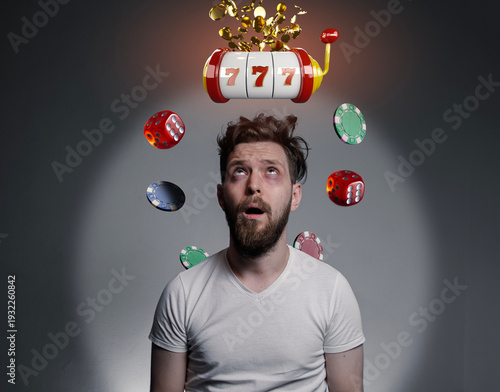 Man with gambling addiction concept , thinking about the slots all the time. Photo manipulation tired man looking up hypnotized  , while slots casino chips, dice are hovering around him 