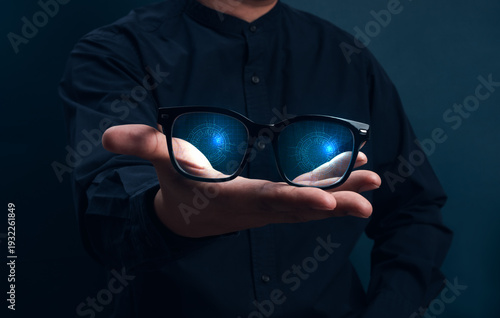 AI-enhanced smart glasses concept with futuristic digital interface reflection. Augmented reality, real-time data analysis, facial recognition, wearable technology and intelligent vision systems.