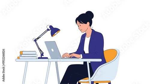 Professional young woman sitting at her office desk and working on a laptop computer in a clean, modern workspace.