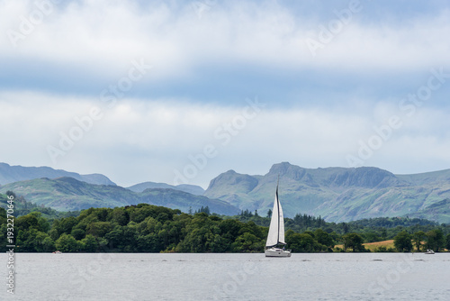 Photos A sail boat crossing Windermere in the English Lake District