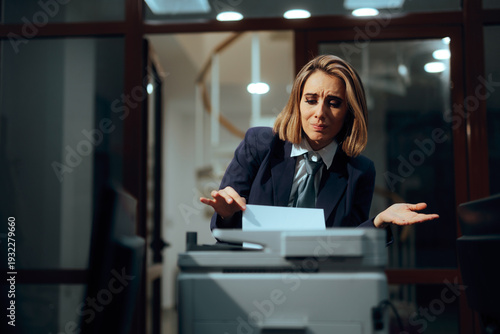 Quadro em tela Frustrated Businesswoman Looking Confused while Trying to use a Printer
