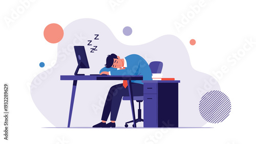 Overworked employee sleeping at his office desk with head down on arms next to computer and messy stacks of paperwork.