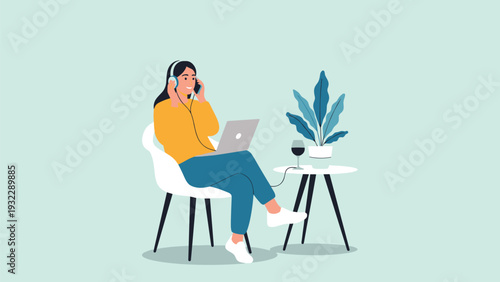 Relaxed woman wears headphones while working on her laptop at a desk with a glass of wine and a potted plant nearby.