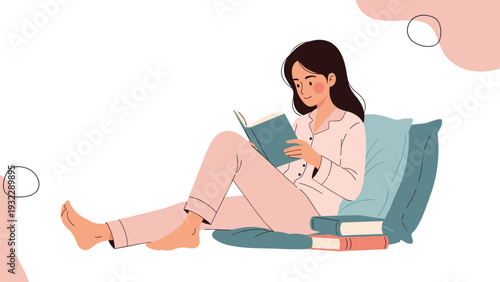 Young woman enjoys a quiet moment reading an interesting book while relaxing comfortably on the floor with soft pillows.