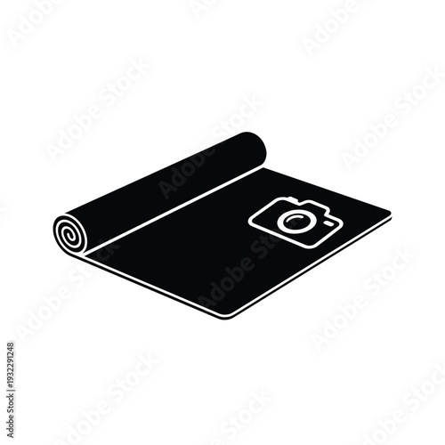 Black rolled up mat with white camera