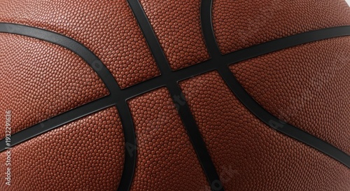 Close-up of a brown basketball with black lines