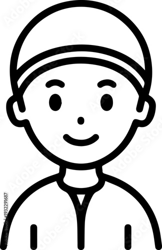 Smiling boy wearing traditional Muslim clothing and kufi cap