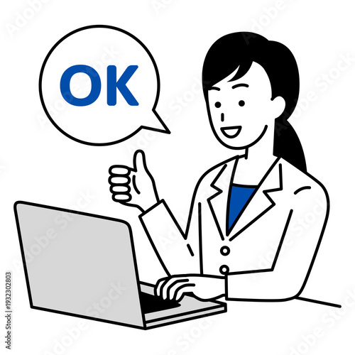ノートパソコンを操作しながらOKサインをする医師の女性
