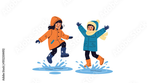 Two happy children wearing warm winter coats and boots jumping into rain puddles with water splashing, enjoying outdoor fun in wet weather.