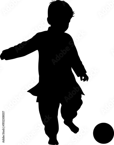 Energetic silhouette of a young boy playfully kicking a ball in an active display of childhood joy and freedom
