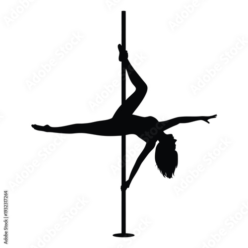 Silhouette of a dancer gracefully performing on a vertical pole