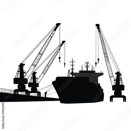 Silhouetted cargo ship and cranes at a busy port facility