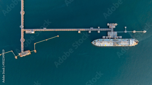 Aerial view oil and gas ship tanker vessel loading unloading in oil terminal station refinery, Global business import export logistic transport sea freight cargo tanker, Oil gas tanker ship at port.