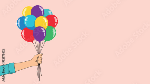 Hand holding a cluster of bright colorful balloons against a soft pink background symbolizing celebration, joy, and parties.