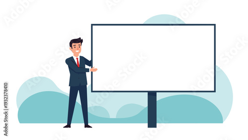 Happy businessman in a suit standing next to a large blank white billboard for advertising or a presentation on a soft landscape background.