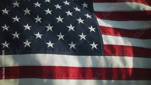 American Flag Waving in the Wind with Stars and Stripes Close Up View