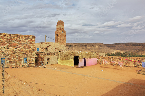 The ancient mosque of the local village close old city Ouadane in Sahara desert, Mauritania