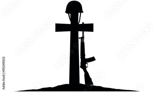 Memorial tribute to fallen soldier with cross helmet and rifle