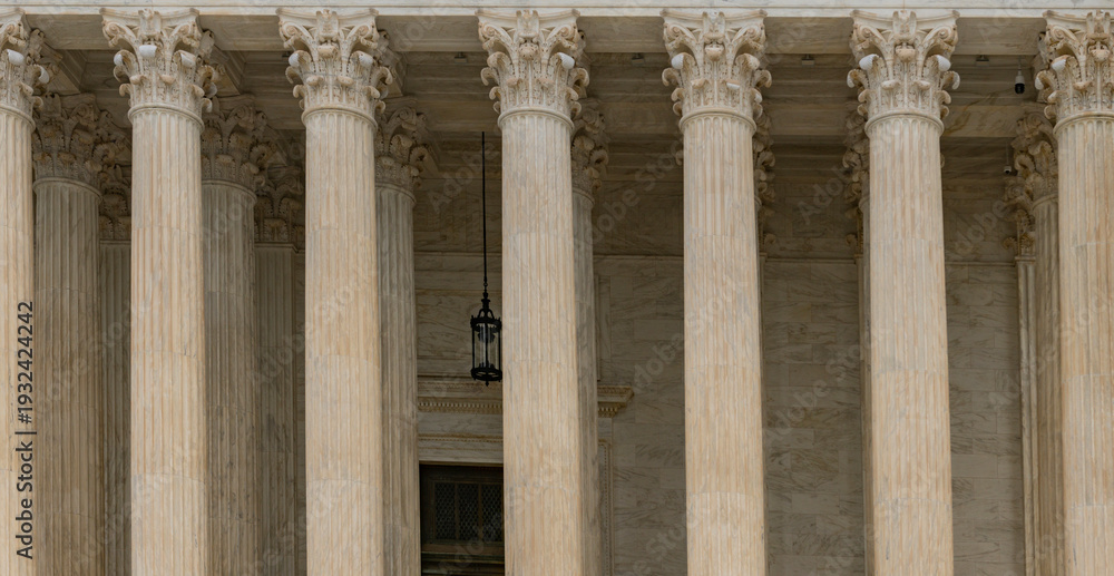 Fototapeta premium Columns fluted marble background texture. Columns repetition symmetry layout. Columns architectural pattern detail. Columns classical stone texture.