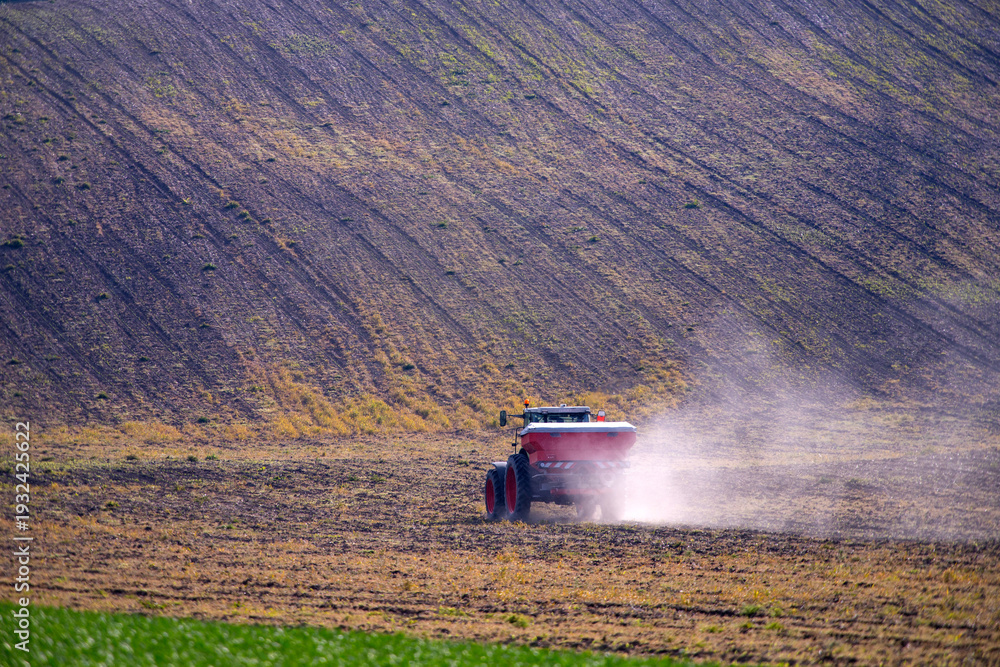 Fototapeta premium Tractor working on the field in Moravia