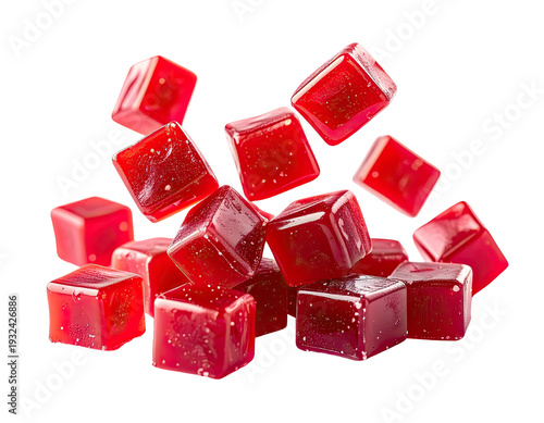 Bright red, translucent, cube-shaped candies scattered randomly