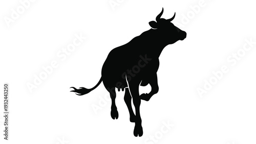 Silhouette of a bull in mid leap showcasing its muscular form and dynamic pose