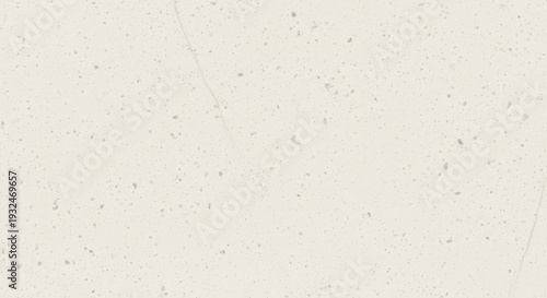 Close-up of textured off-white background with small specks
