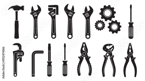 Set of black and white silhouettes of various hand tools on a white background
